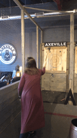 Woman throwing an axe at axeville